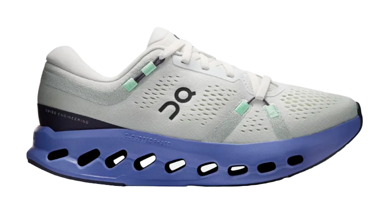 White running shoe with purple sole on a white background